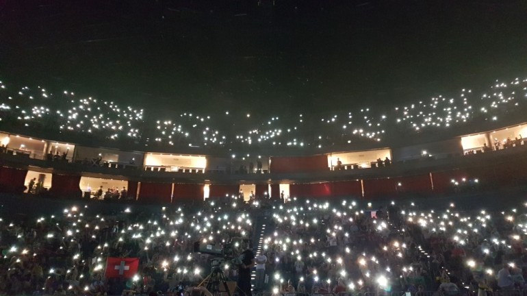 A picture of stadium crowd with everyone holding their phone lights in the air. Looked very pretty.